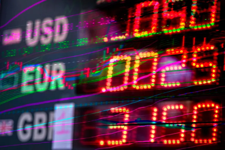 a close up shot of numbers and stock charts