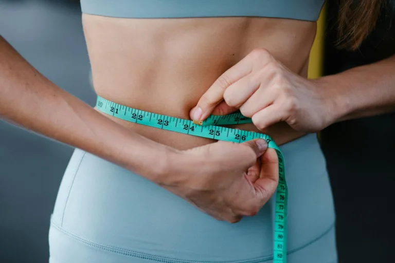woman measuring her abdo
