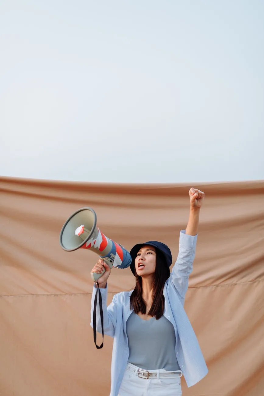pretty woman holding a megaphone